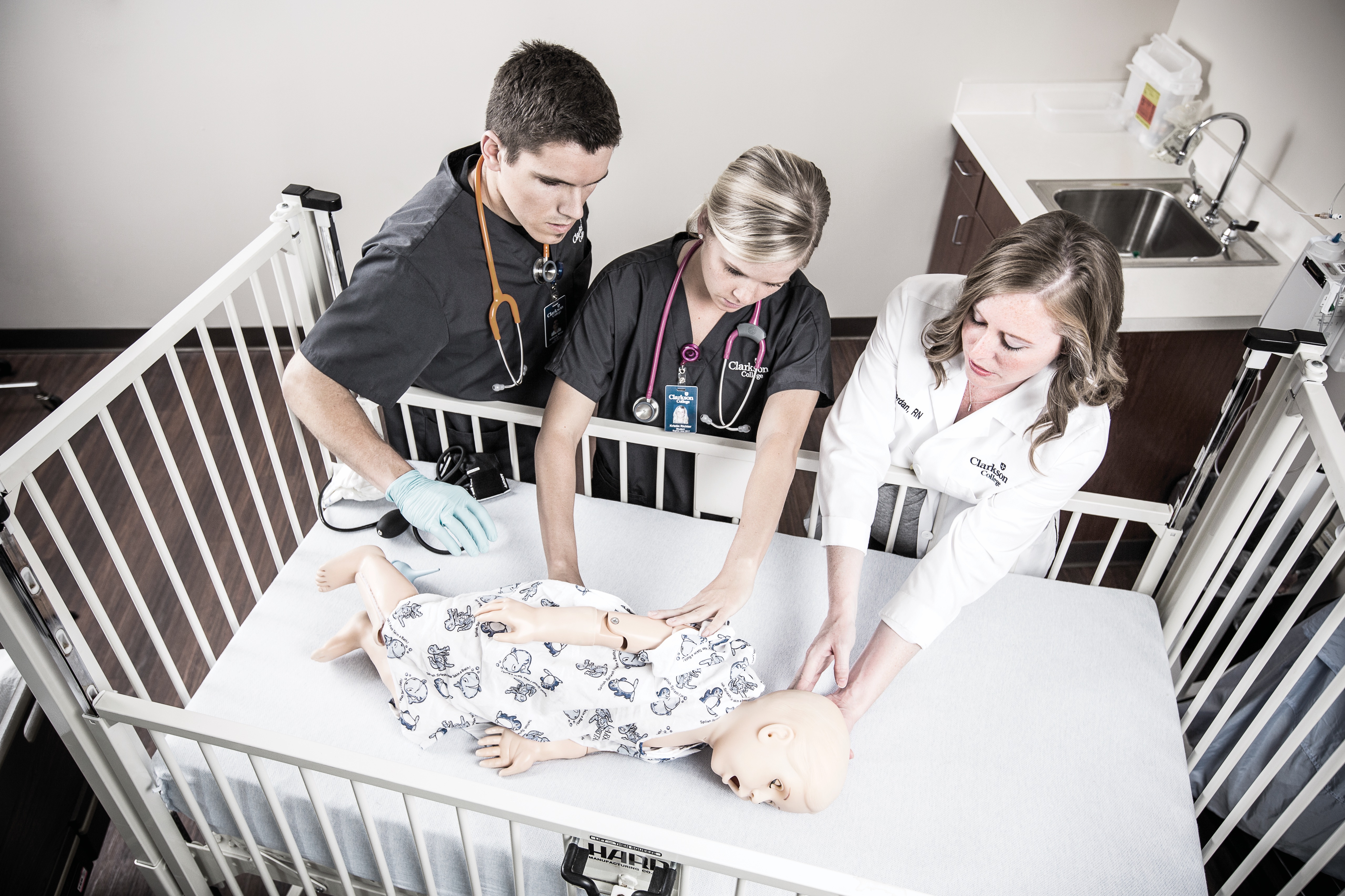 Nursing students practice pediatrics skills in the Simulation Lab.