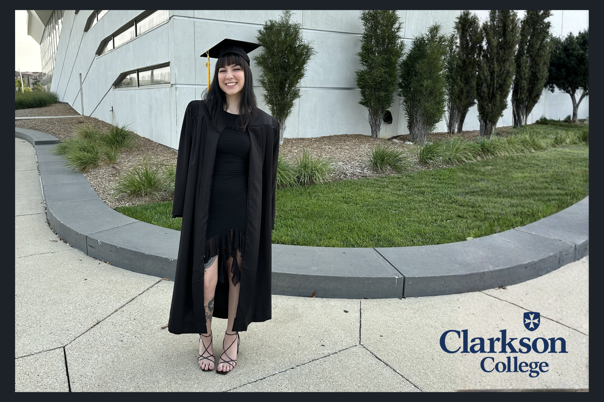 Student, Shyanne Vargas, standing in her graduation regalia